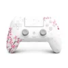 SCUF Omega Cherry Blossom PS5 controller, front view with white shell and pink floral artwork
